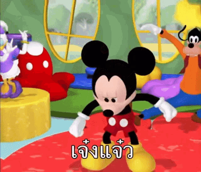 mickey mouse is dancing in a room with goofy and donald duck