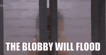 a woman is looking out of a window with the words `` the blobby will flood '' written on the screen .