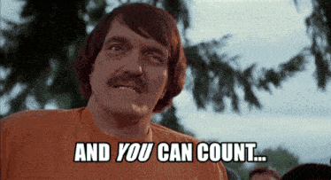 a man with a mustache is wearing an orange shirt that says and you can count