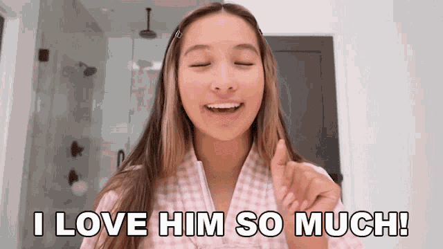 a girl says i love him so much while giving a thumbs up
