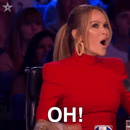 a woman in a red dress is sitting in a chair and saying oh