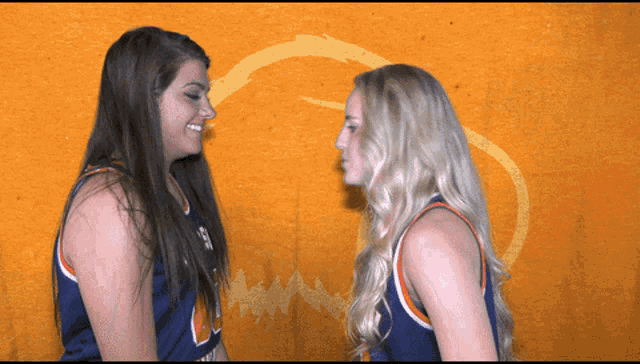 two female basketball players standing face to face