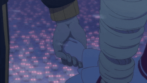 a person holding another person 's hand in front of a crowd