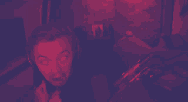 a man wearing headphones is looking at the camera