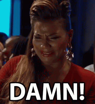 a woman in a red shirt is crying and says damn .