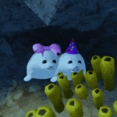 two seals wearing party hats are surrounded by sponges