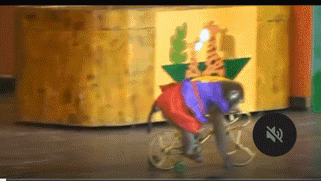 a monkey is riding a bike in front of a sign that says " silence "