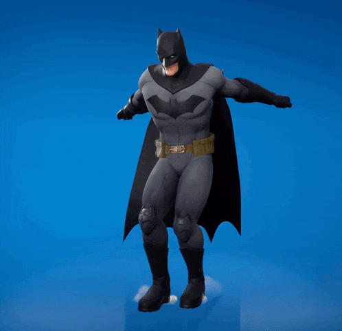 a man in a batman costume is making a face with his hands