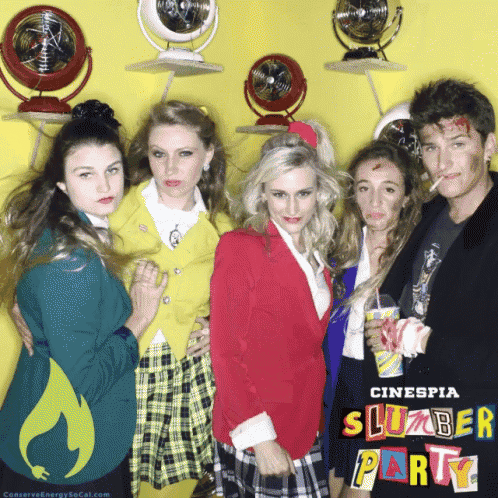 a group of people posing for a photo with a sign that says ' cinesia slubber party '