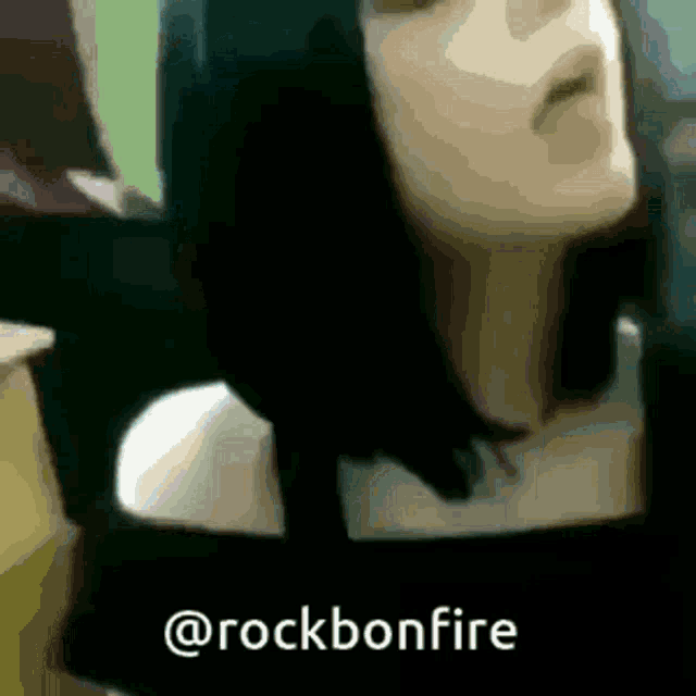 a close up of a woman 's face with the words @rockbonfire written below her