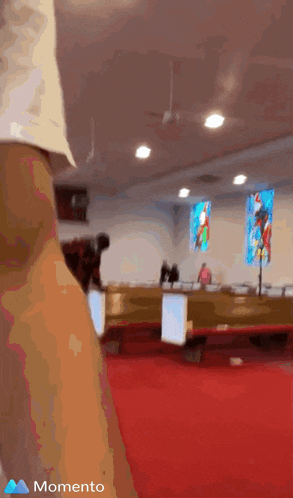 a blurry picture of a church with the word momento on the bottom left