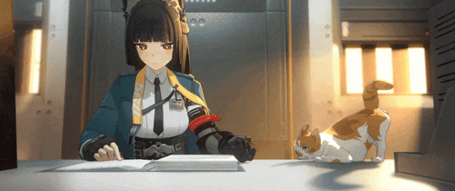 a girl in a blue uniform sits at a desk with a cat on it