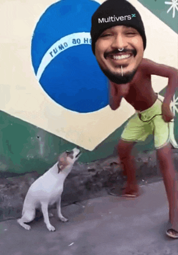 a man wearing a black multivers hat stands next to a small dog