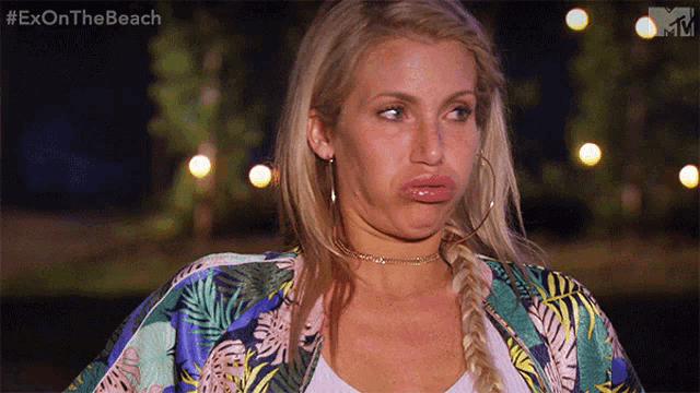 a woman making a funny face with the hashtag #exonthebeach