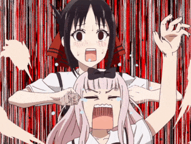 a girl with a bow on her head is screaming next to another girl with a bow on her head