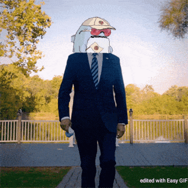 a man in a suit with a shark on his head