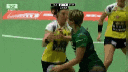 a handball game between ika and vhk is going on