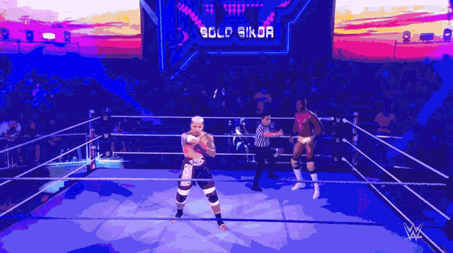 two wrestlers are in a ring with a sign that says solo sikor