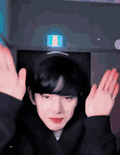 a person is making a funny face with their arms outstretched