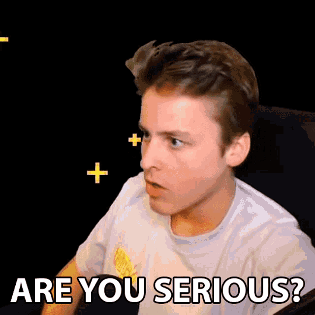 a man in a white shirt says " are you serious " in front of a black background
