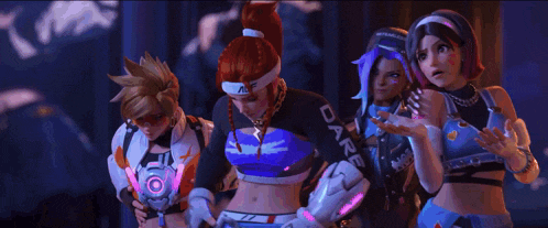 a couple of women are standing next to each other in a room with a blue light behind them .