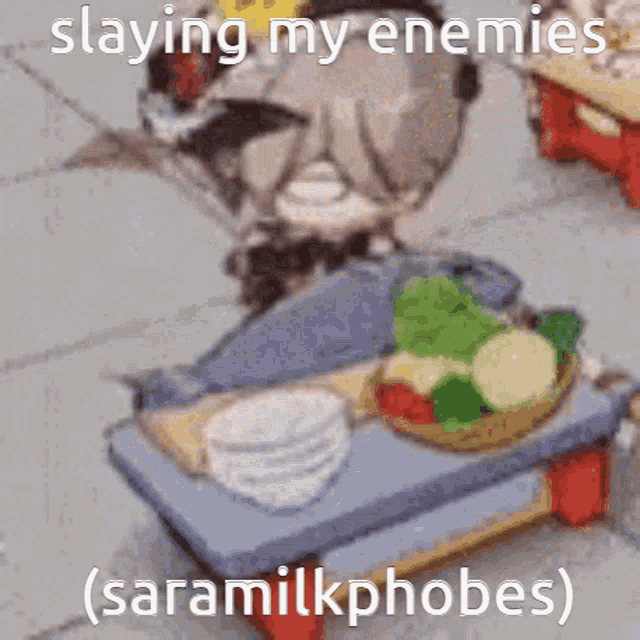 a cartoon character is sitting on a table with a bowl of vegetables on it and says slaying my enemies