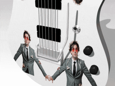a man in a suit is standing in front of a guitar