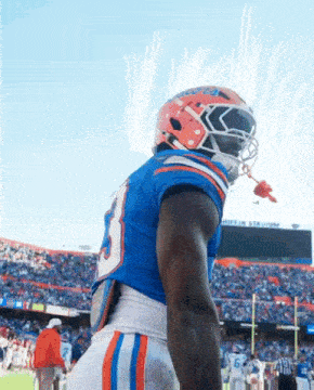 a football player wearing a helmet with the number 9 on it