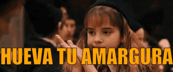 a young girl in a harry potter hat says " hueva tu amargura "