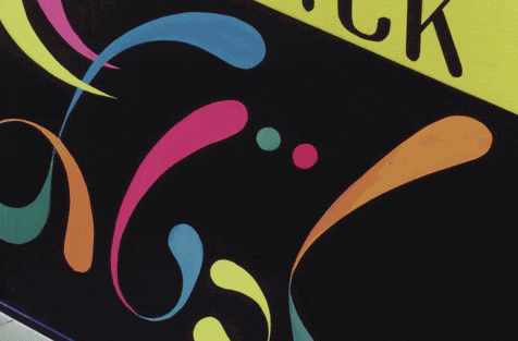 a blue and purple machine with a swirl design on the front