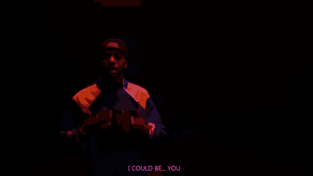a man in a colorful jacket is saying i could be you in the dark .