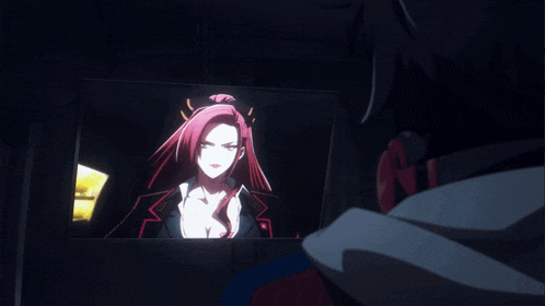 a man looks at a picture of a woman with red hair in a dark room