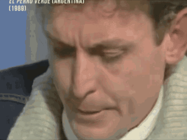 a close up of a man 's face with the year 1989 visible