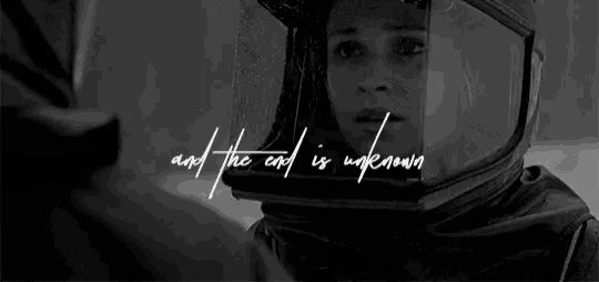 a black and white photo of a woman wearing a helmet with the words and the end is unknown