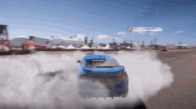 a blue car is drifting in a video game with smoke coming out of the back