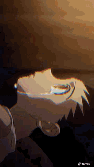 a close up of a person 's face with their eyes closed and a glitch effect .