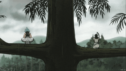 a couple of people sitting on a tree branch looking out