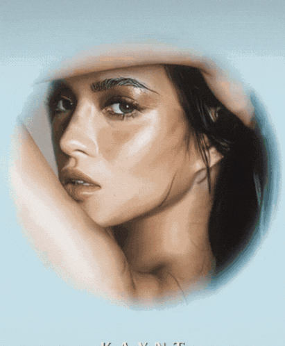 a close up of a woman 's face in a circle with the word kayne on it