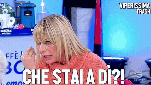 a woman is making a funny face and says che stai a di ?