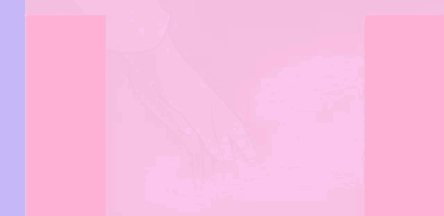 a close up of a person 's hand on a pink surface .