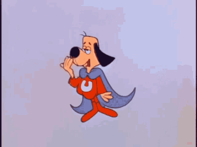 a cartoon dog is wearing a cape and a red superhero costume .