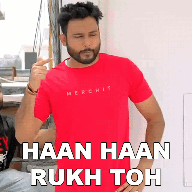 a man wearing a red merch t-shirt says " haan haan rukh toh "