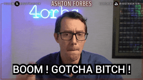 a man with glasses says boom ! gotcha bitch !