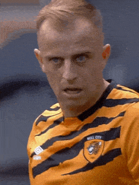 a man in a hill city jersey looks at the camera