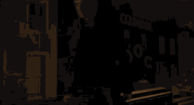 a close up of a person holding a sword in a dark room with a light coming out of it .