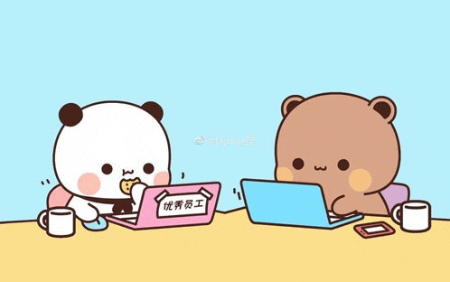 two cartoon bears are sitting at a table with a laptop .