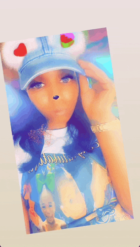 a woman wearing a denim hat and a shirt that says ' always ' on it