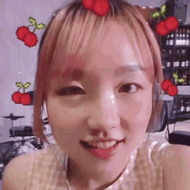 a girl with pink hair has cherries on her hair