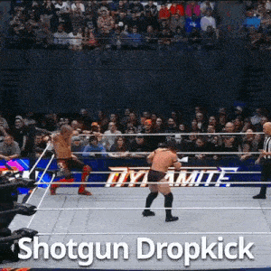 a shotgun dropkick is being performed by a wrestler in a dynamite wrestling ring