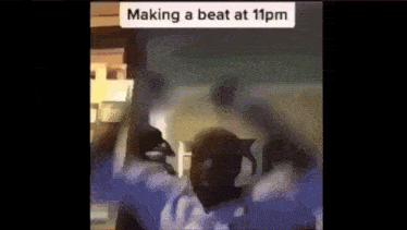 a person is making a beat at 11pm in a video .
